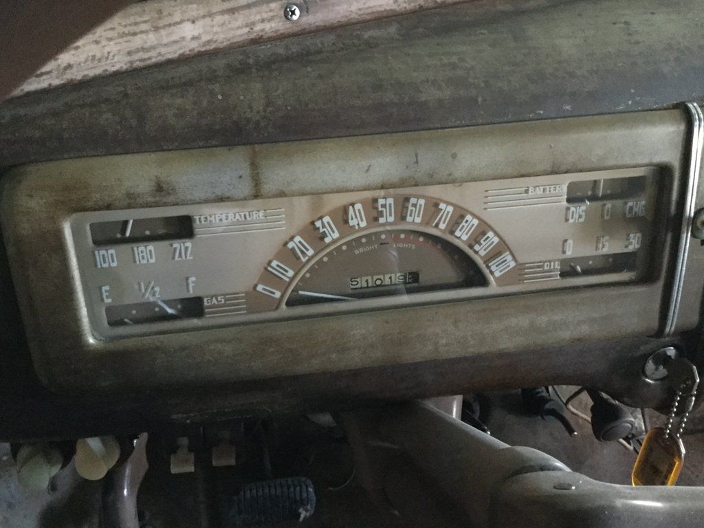 speedometer and odometer of black 1940 chevy special deluxe coupe