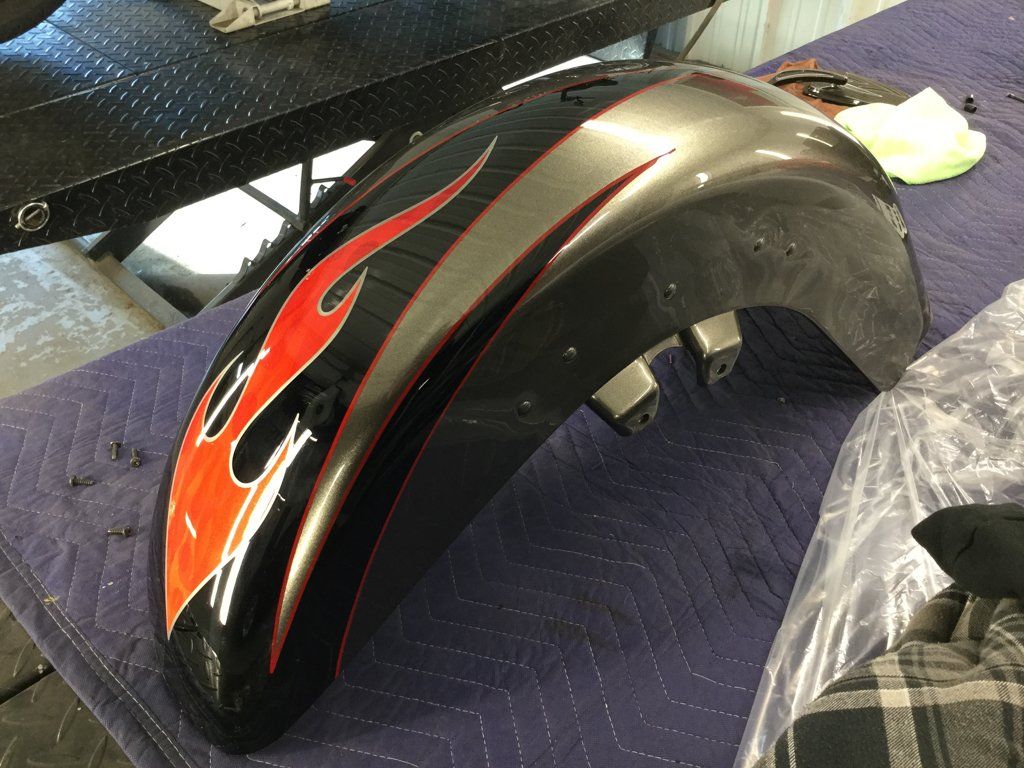 close up of front fender of customized black three wheel motorcycle