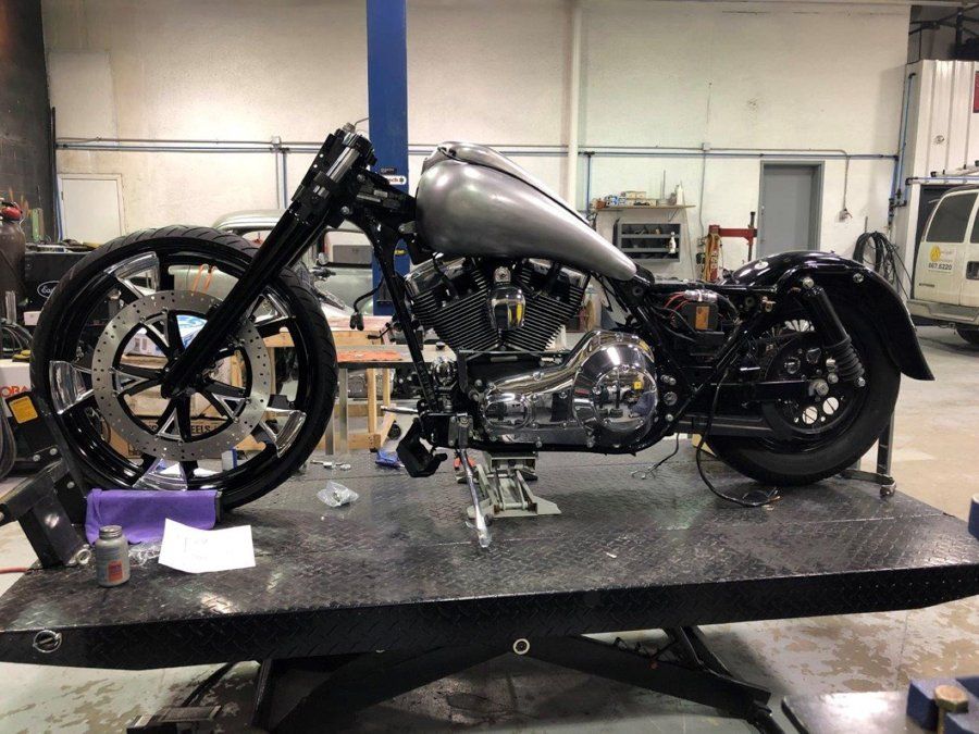 side view of black chopper with handle bars removed