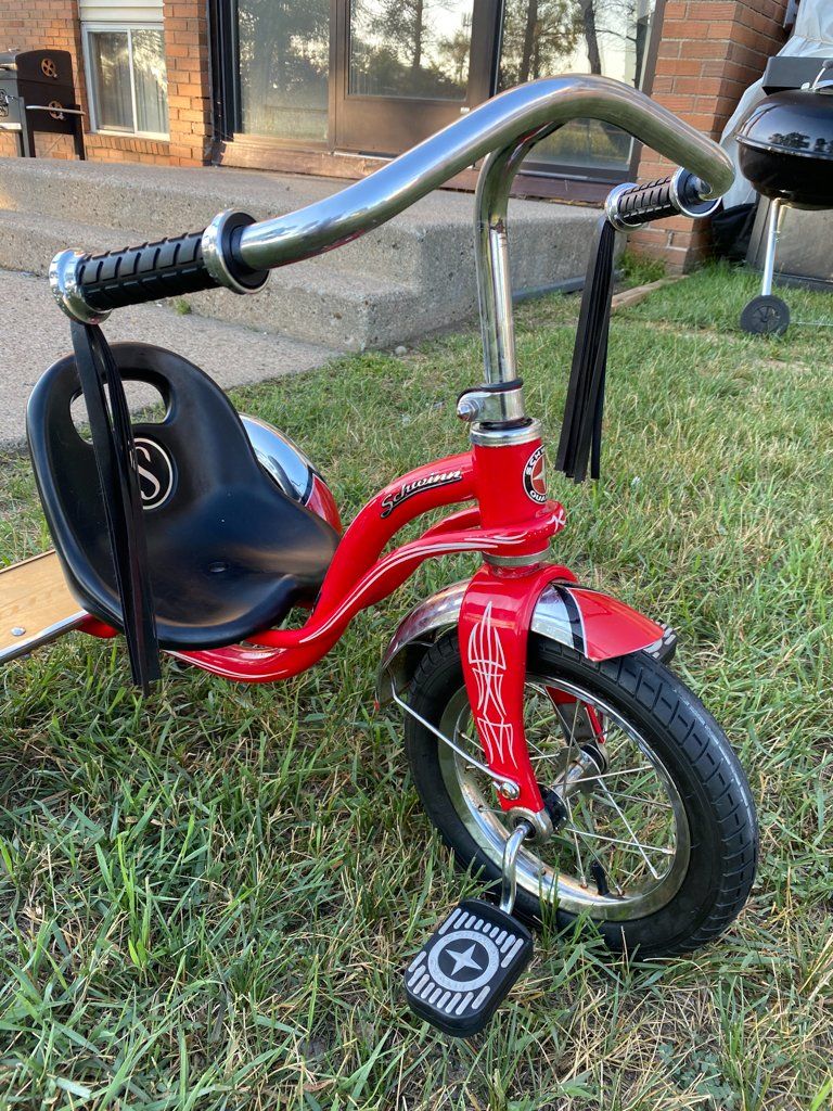 close up of custom striping on red tricycle