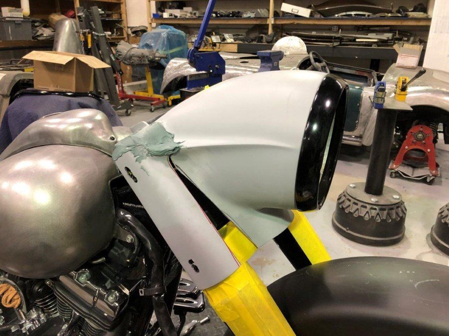 side view of black chopper with new headlight cover