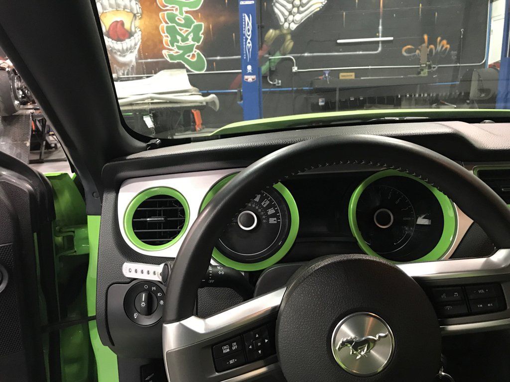 customized speedometer and dashboard black with bright green trim