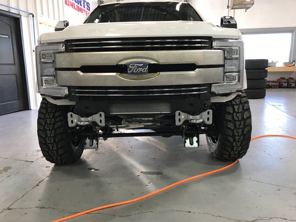 front view of custom white 2017 ford f350 pickup truck dakota kustomz without front fender
