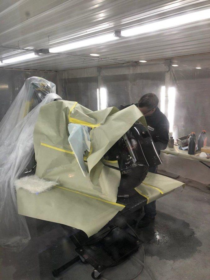 black chopper covered in paper and tape