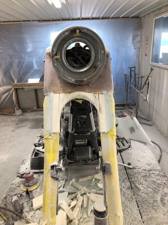 front close up of black chopper stripped of paint and headlight removed