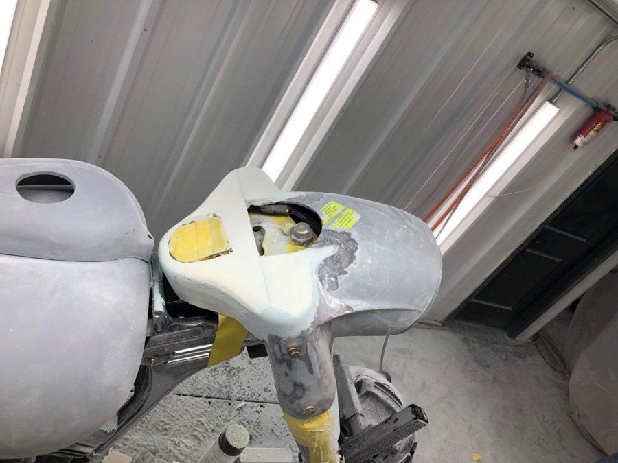 black chopper headlight stripped of paint