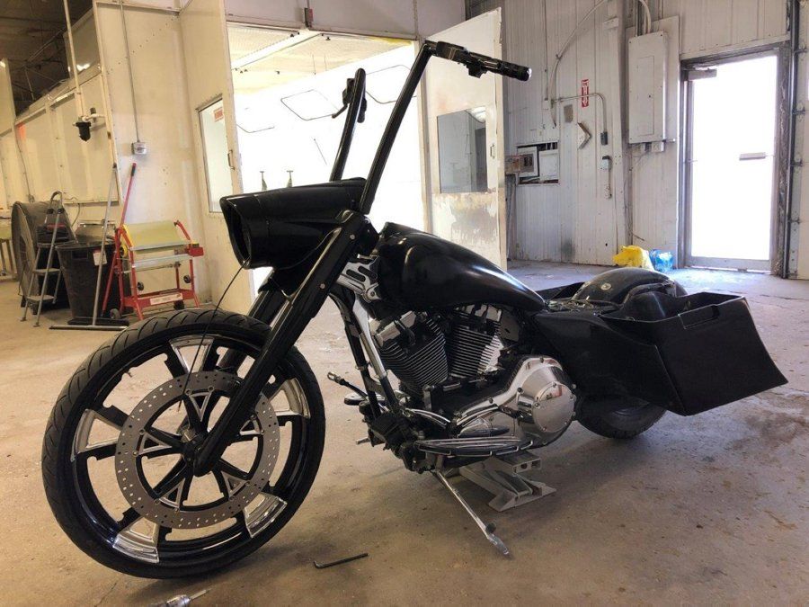 left side view of black chopper before customization