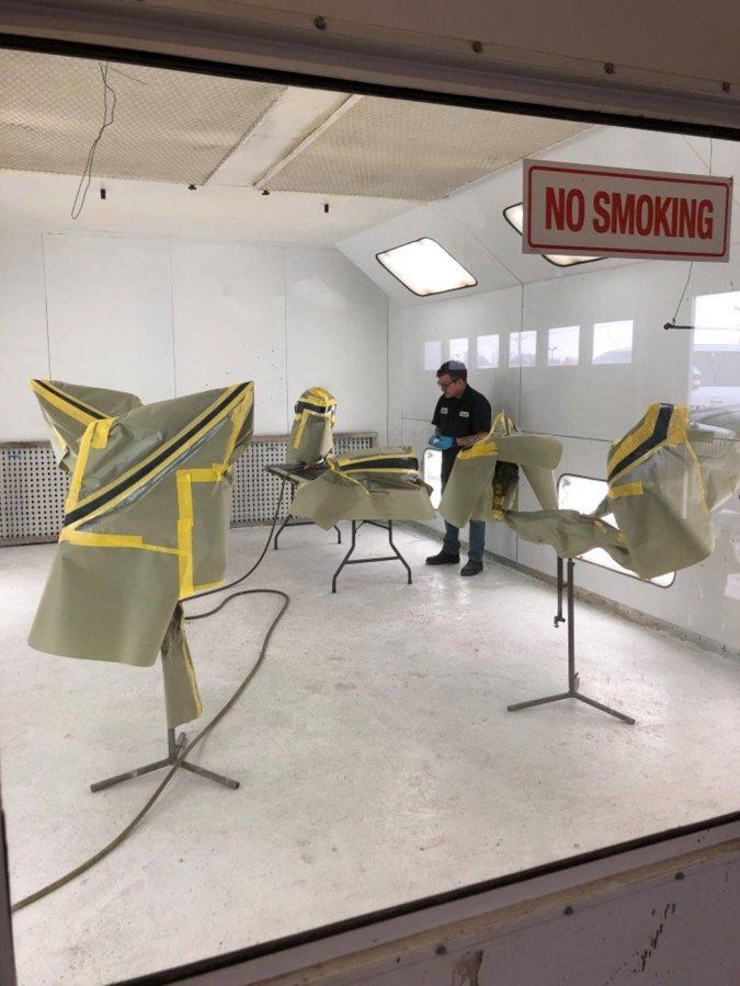 custom black chopper parts getting painted in paint room