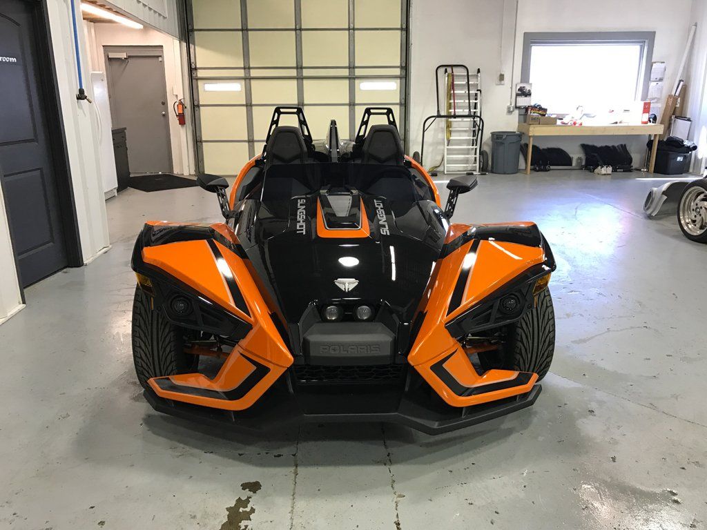 custom orange and black polaris slingshot front view