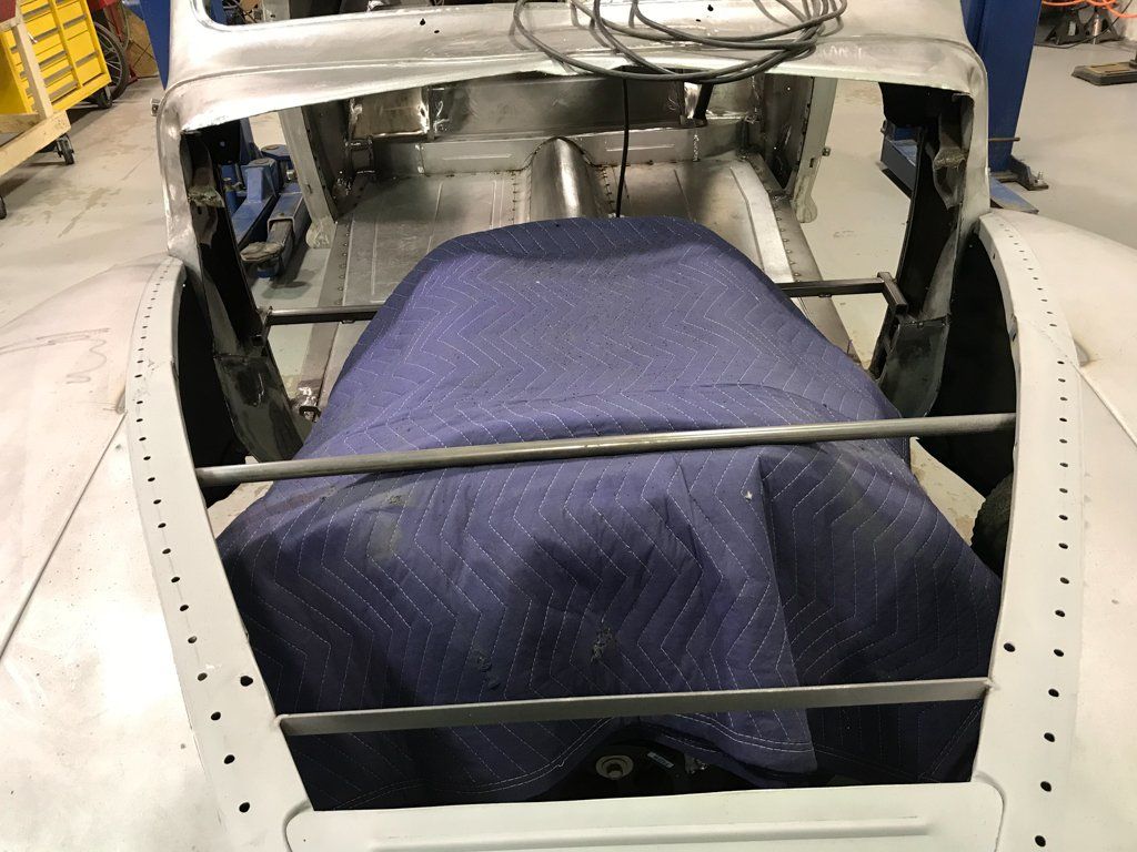 moving blanket on top of car parts