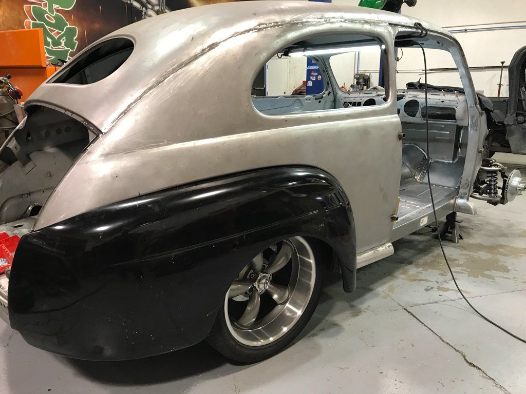 rear side view of car with black fender attached