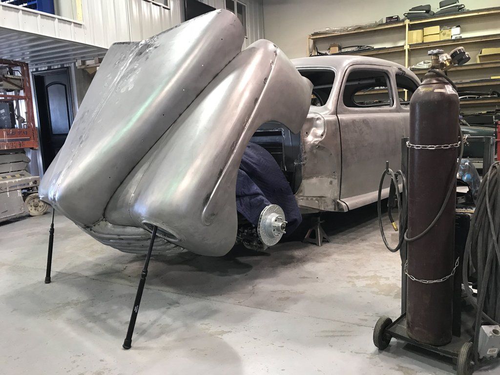 car hood opened with paint stripped