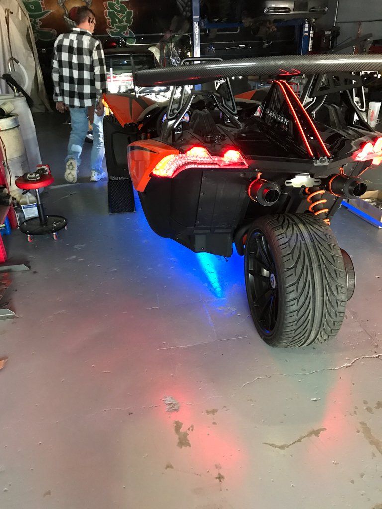 custom orange and black polaris slingshot rear