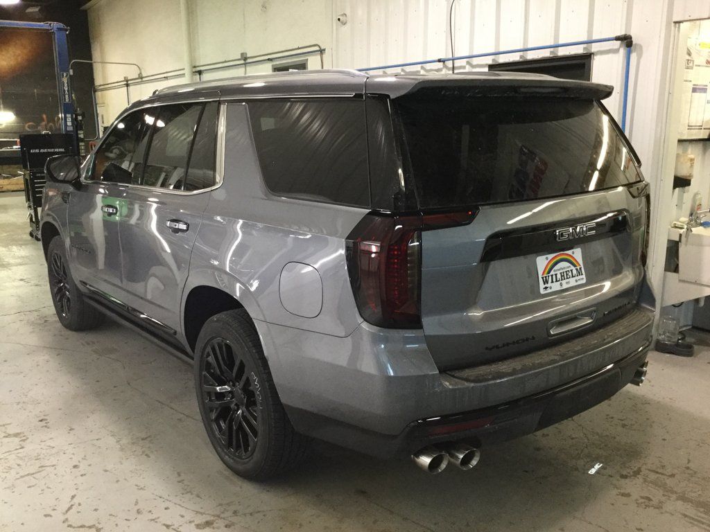 rear view of customized charcoal grey suv in garage