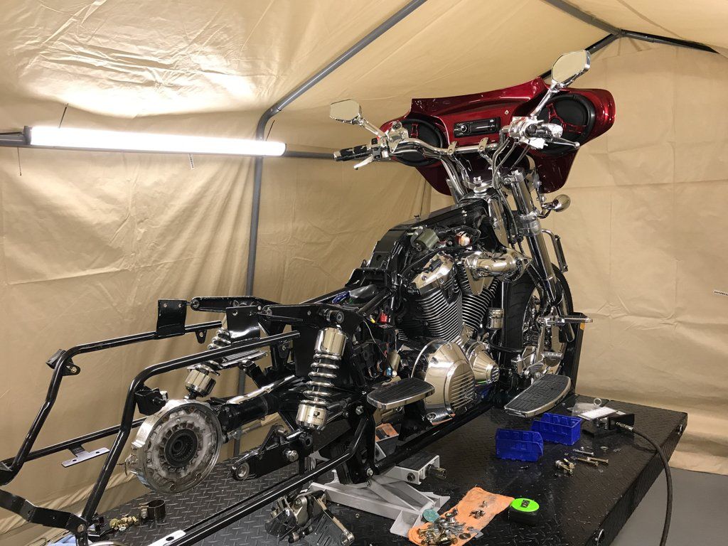 rear side view of motorcycle stripped of plating