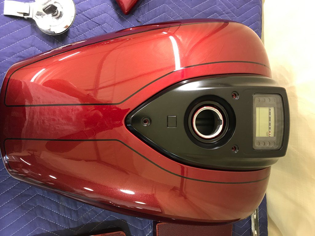 red motorcycle part isolated on workbench