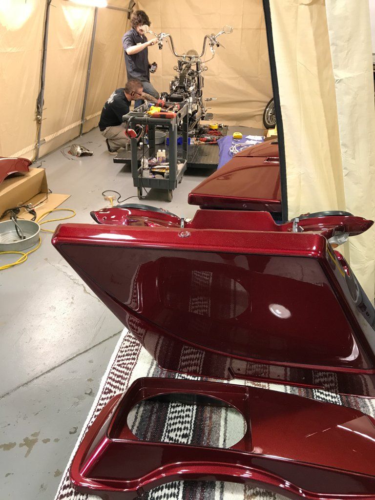 motorcycle parts removed and laid out on table