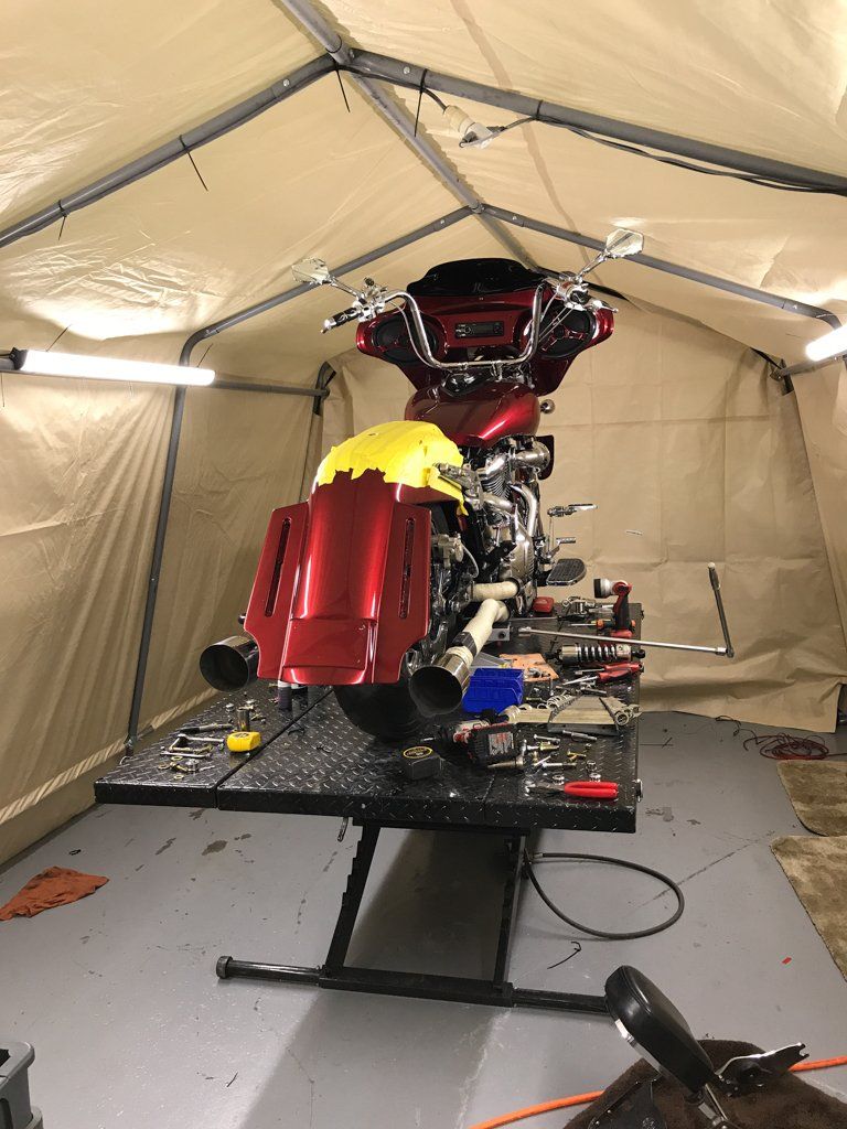 rear view of motorcycle with yellow tape on rear fender