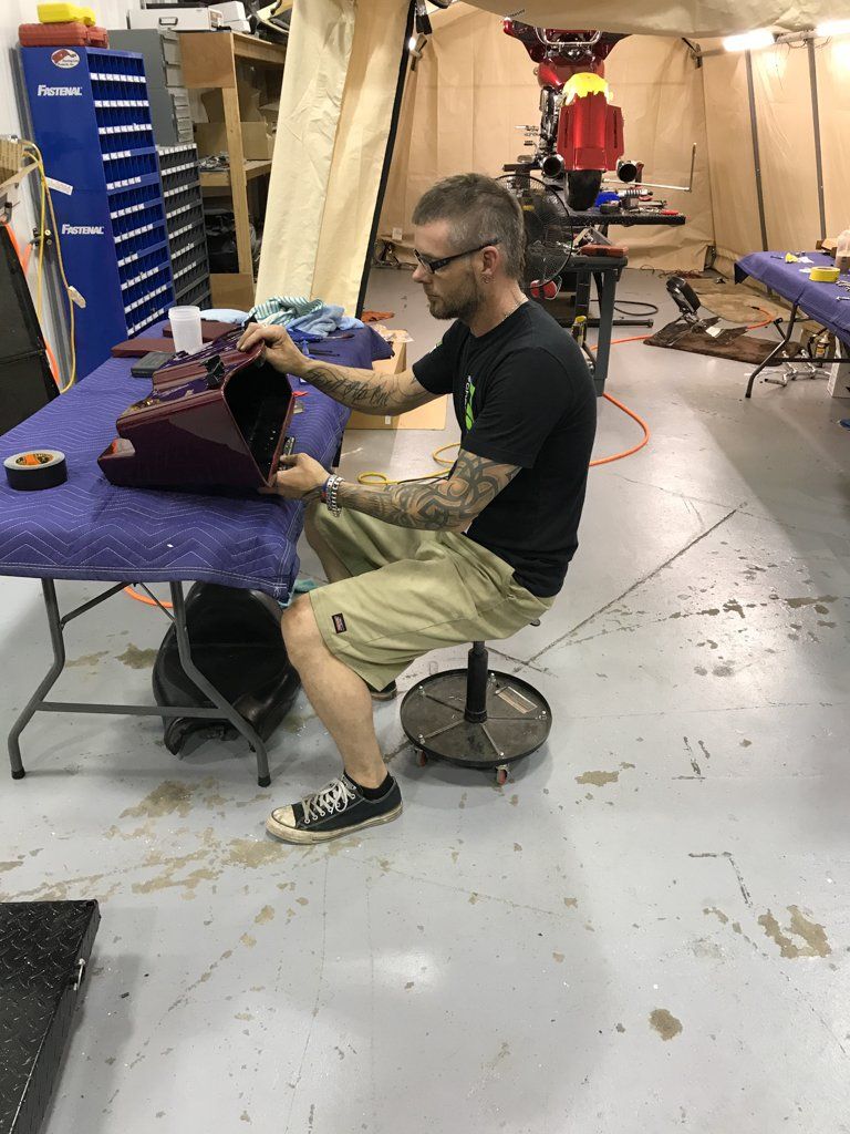 mechanic inspecting custom part