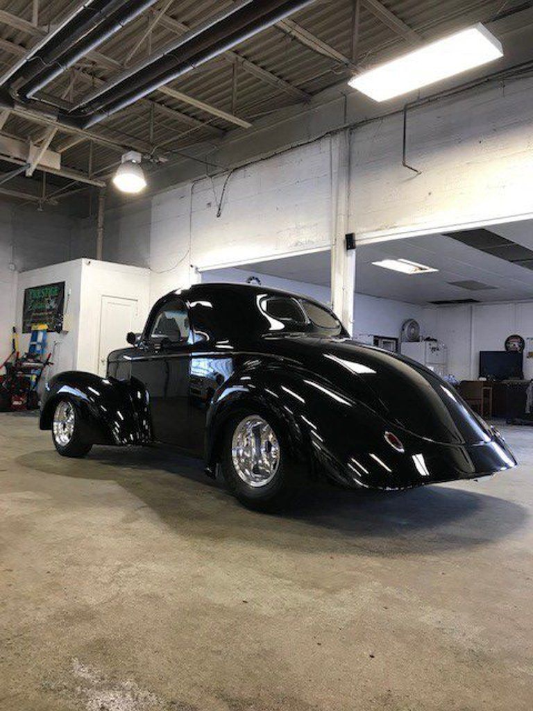 rear side profile view of custom black 1941 willys coupe