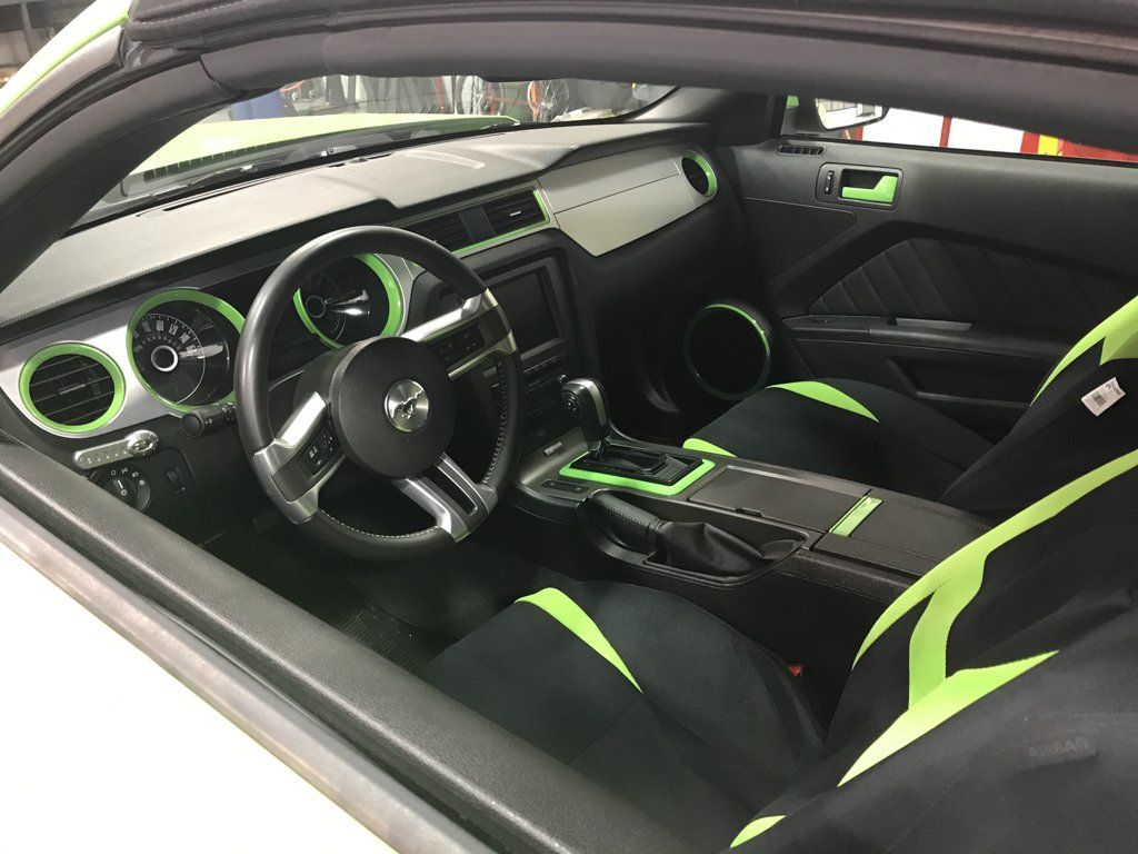 interior view of black and green mustang interior