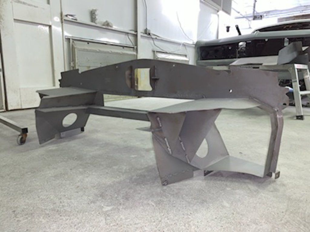 painted car parts on ground