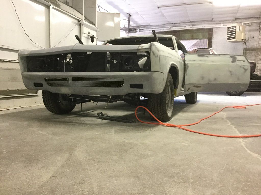 driver side view of internals of car with no engine