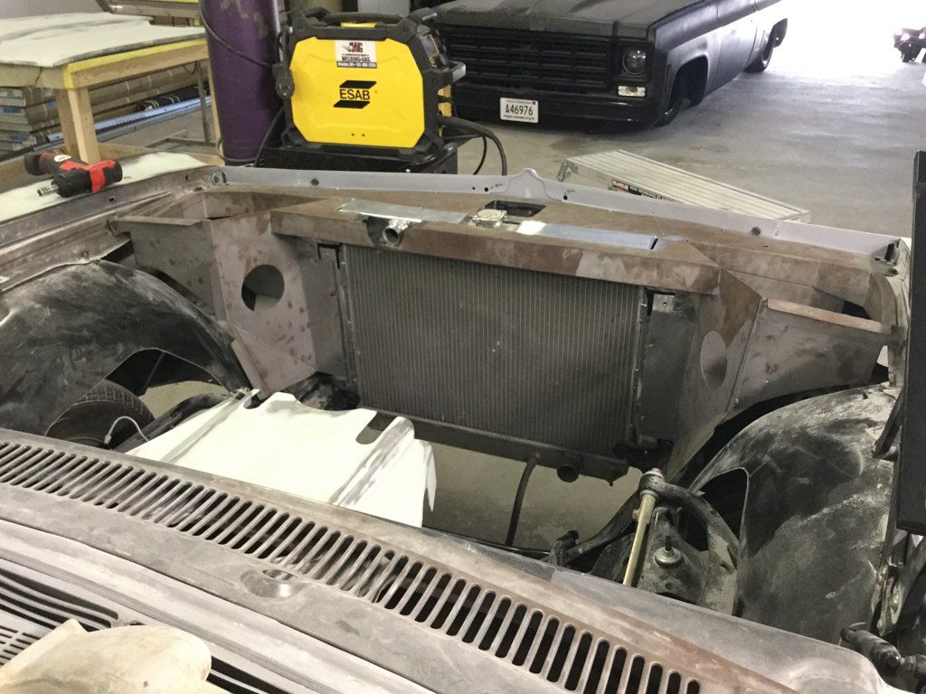 driver side close up of car internals with no engine