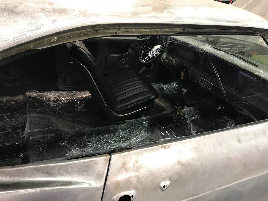 passenger side view of car looking in