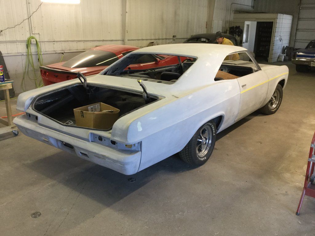 rear view of car with no trunk and boxes in storage