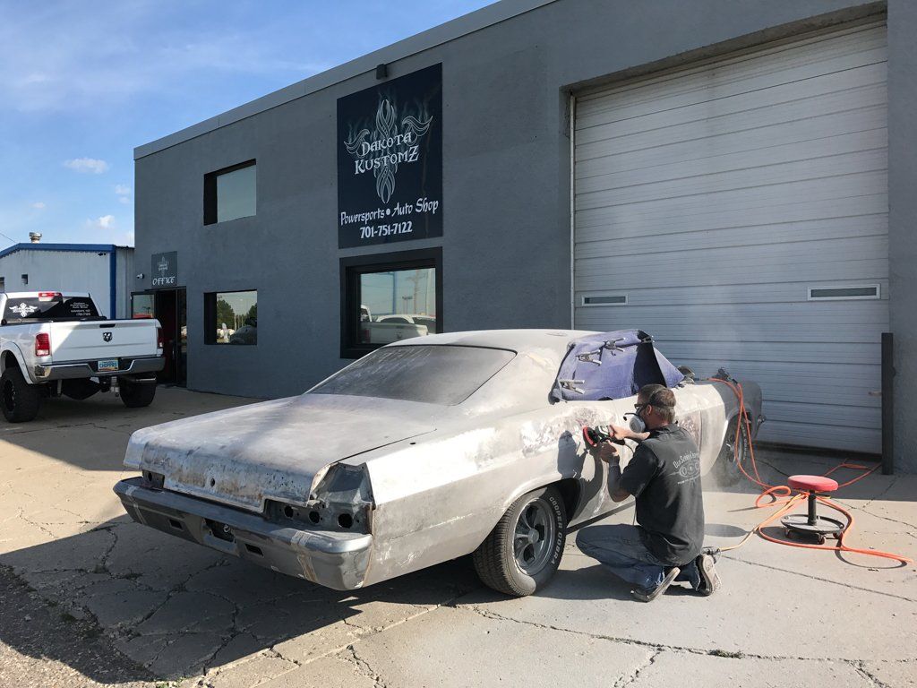car being detailed outside of dakota kustomz garage