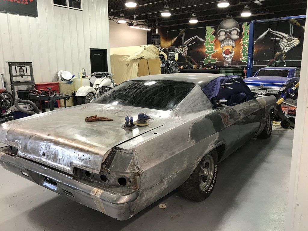 rear view of car with tools on trunk