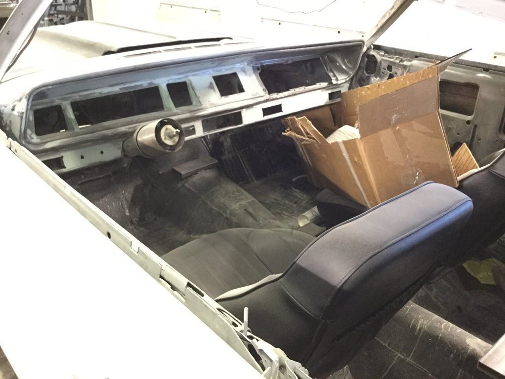 driver side view of driver's seat missing steering wheel