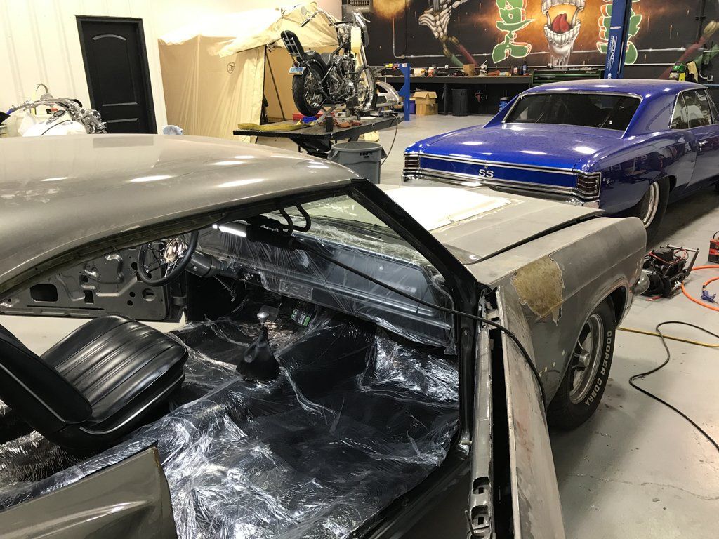 front passenger view of car door open with passenger seat missing