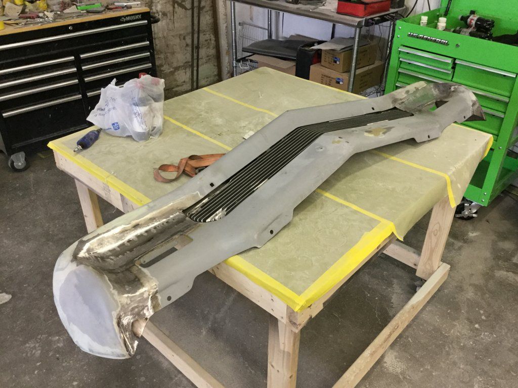 front car grill removed on workbench