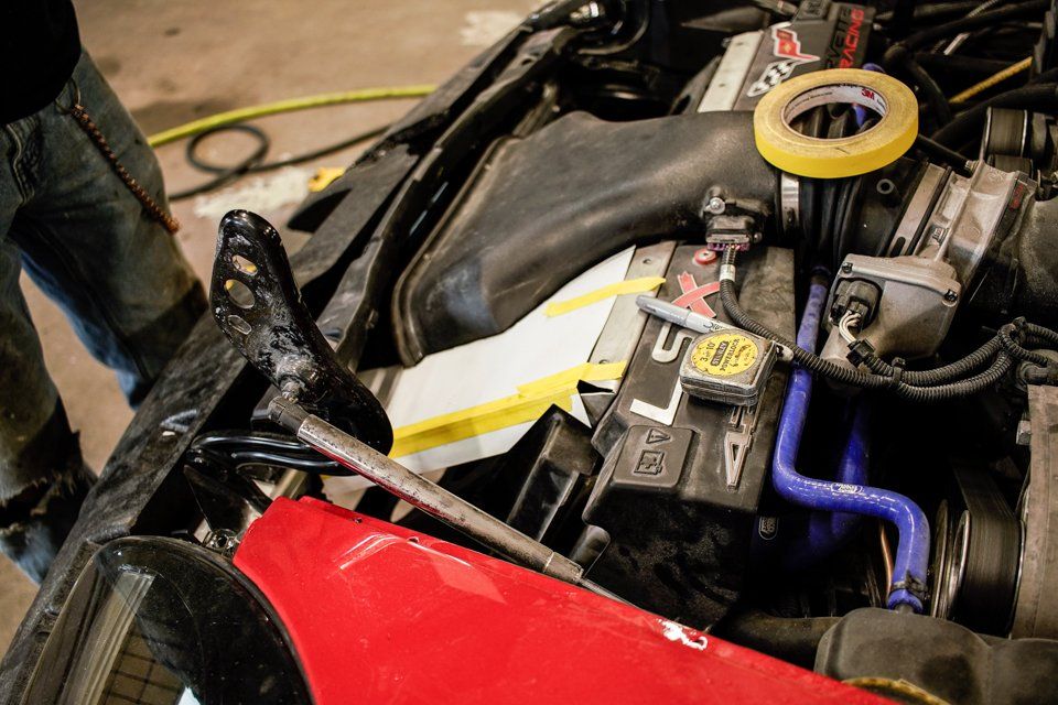 close up of air intake of red corvette