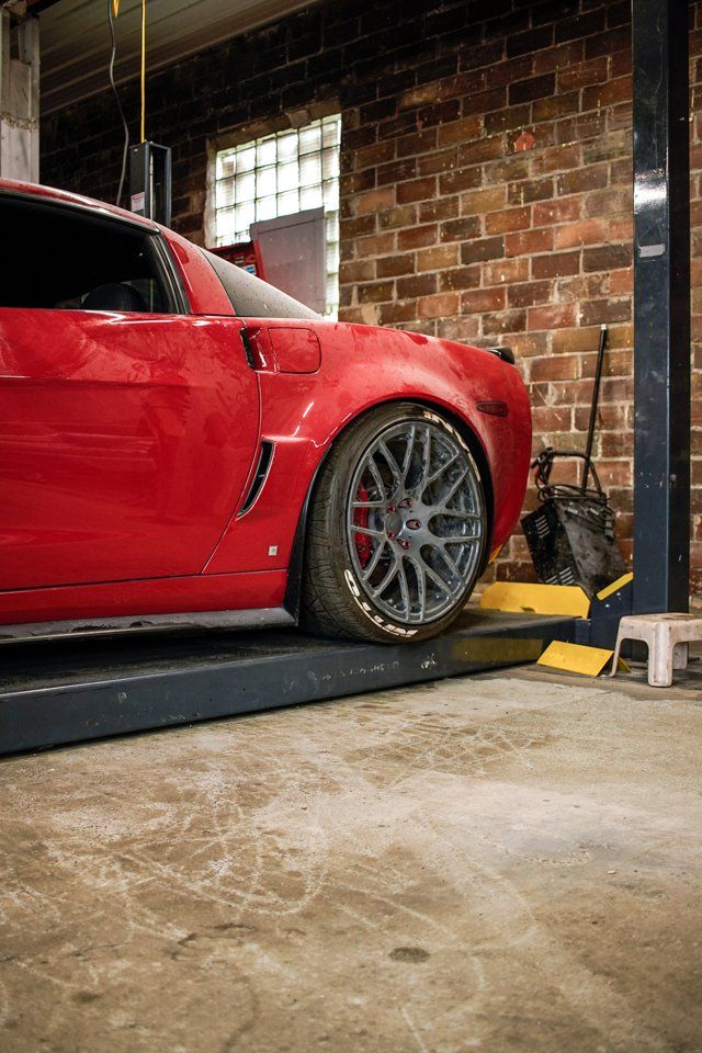 custom red 2006 corvette car view of driver's side rear wheel