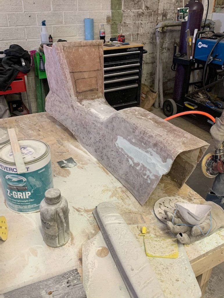 wooden car part on workbench