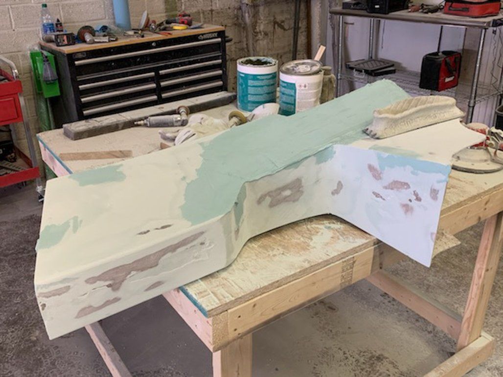 wooden car part on workbench