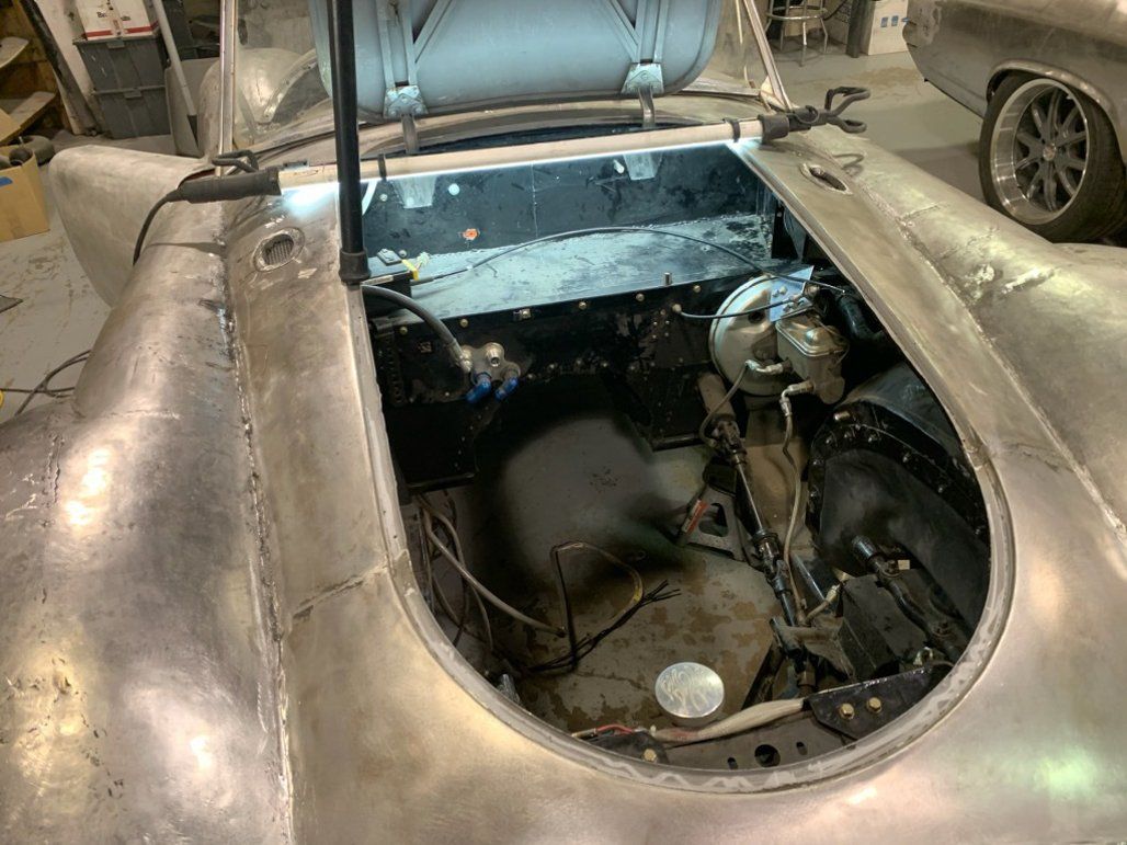 car hood opened with engine removed