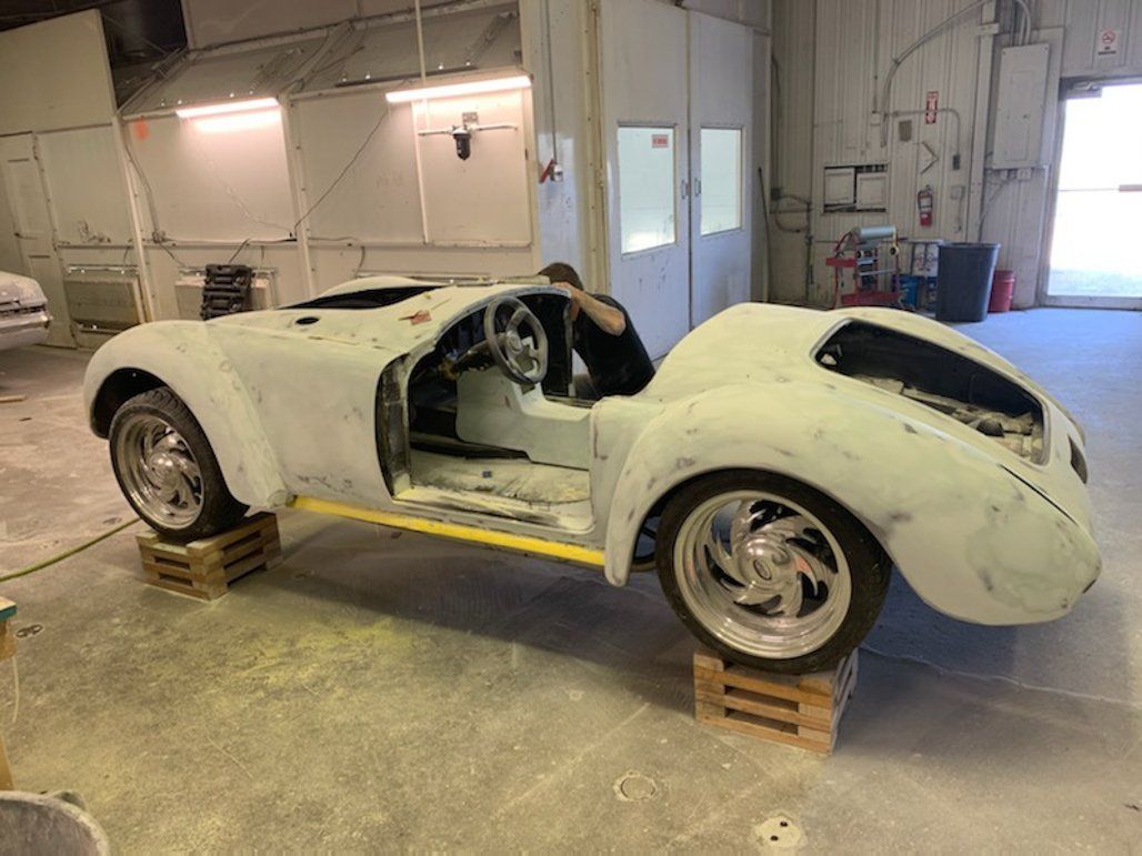 side view of car suspended on crates