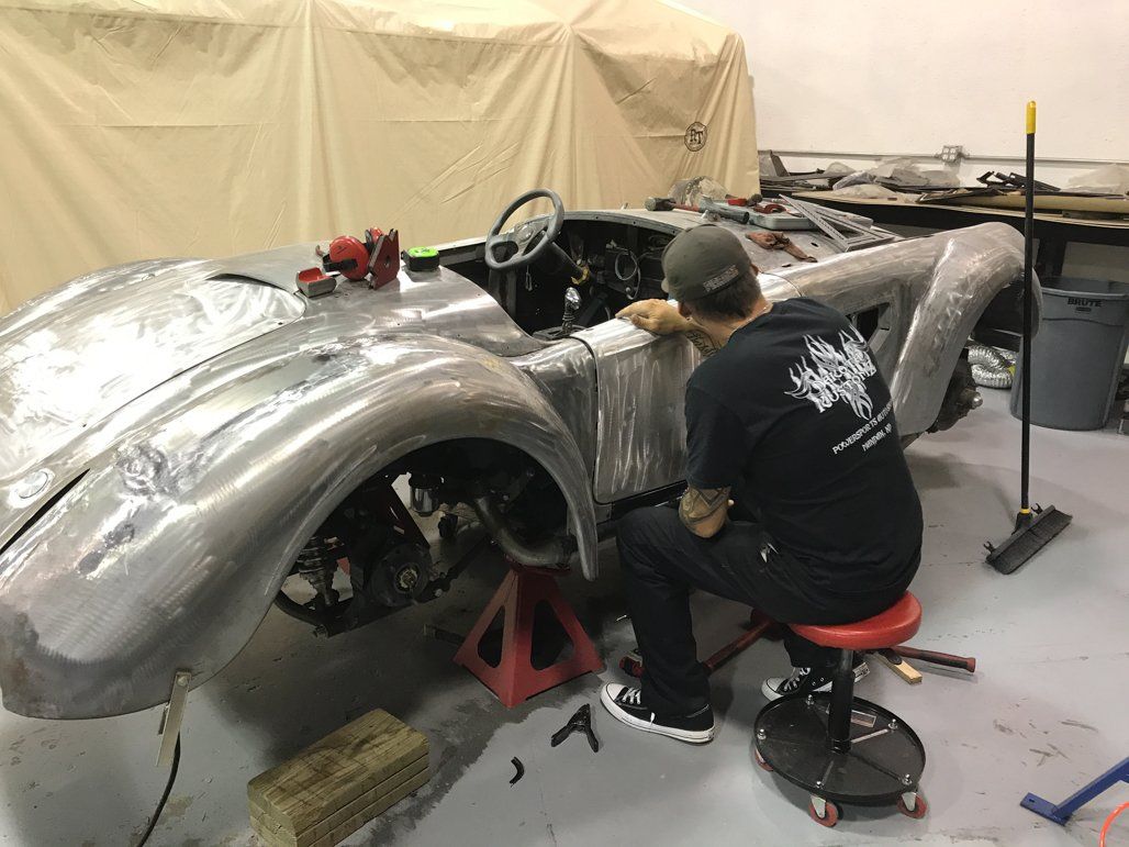 sitting working inspecting car door