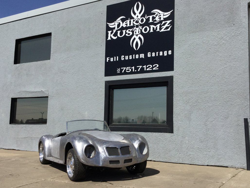roadster in front of dakota kustomz shop
