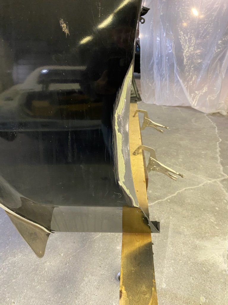 car fender held together by two clamps