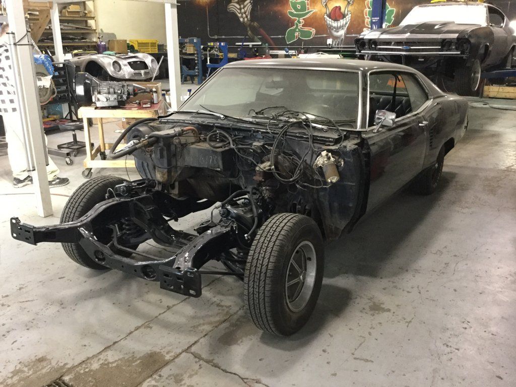 car with exposed engine and no hood