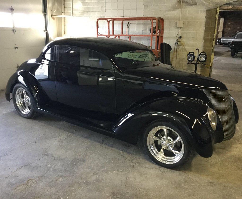 side profile of custom black 1937 ford tudor hot rod