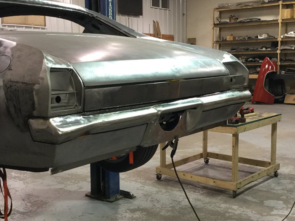 rear view of car suspended on service bayrear view of car suspended on service bay