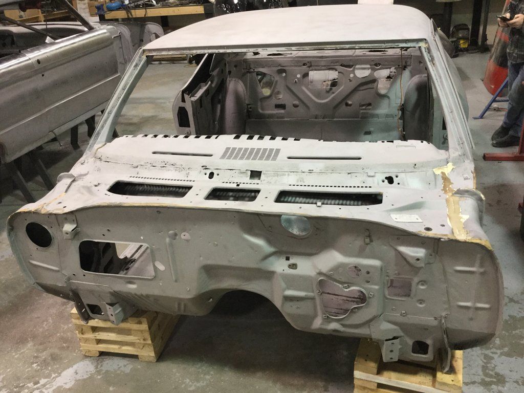 car frame missing and suspended on crates