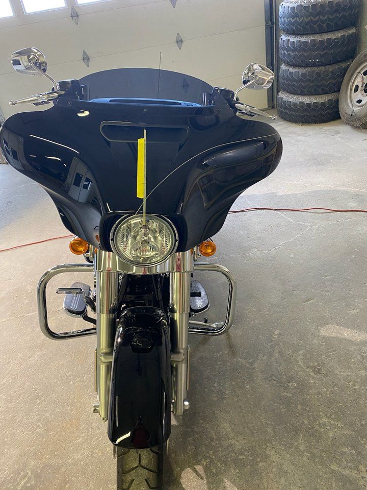 front view of motorcycle with yellow tape on motorcycle half customized