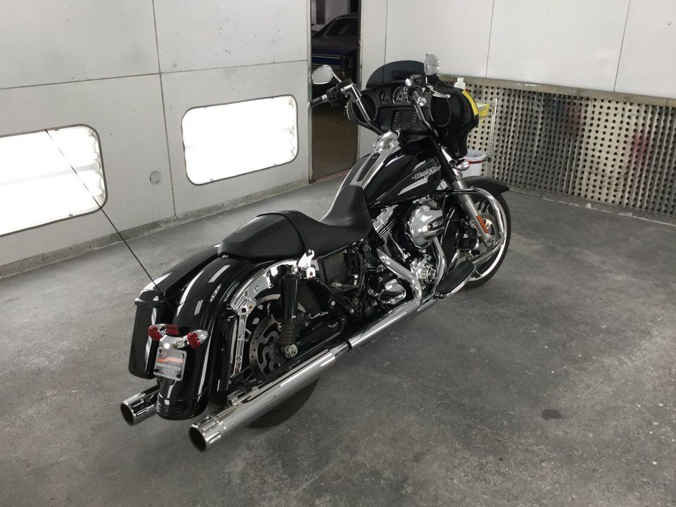 rear side view of black motorcycle before pin-striping